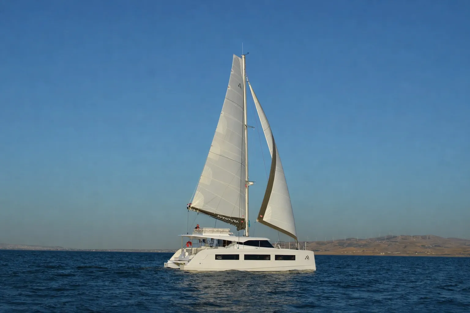 The Aventura 45 sailing in calm evening light